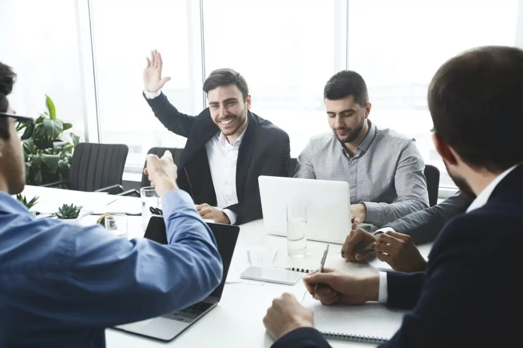 businessman-raising-hand-and-asking-question-at-meeting-1024x682.jpg